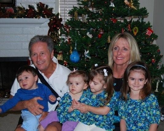 Denise Harris Henke and her husband Larry with their four grandchildren at Christmas in 2008.